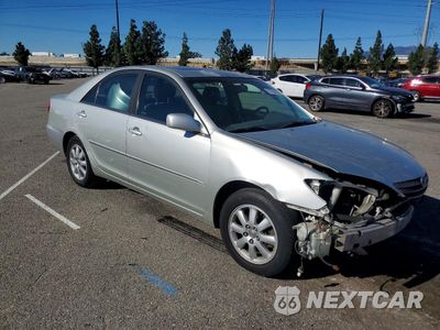 Czwarte zdjęcie samochodu z boku: 2002 TOYOTA CAMRY LE VIN:JTDBF30K620005894 - miniatura