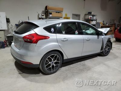 Trzecie zdjęcie samochodu z tyłu: 2017 FORD FOCUS SEL VIN:1FADP3M29HL302090 - miniatura
