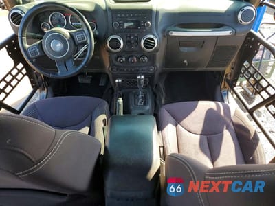 Zdjęcie 8 z 11 samochodu: 2014 JEEP WRANGLER UNLIMITED SAHARA VIN:1C4BJWEG1EL210563 - miniatura