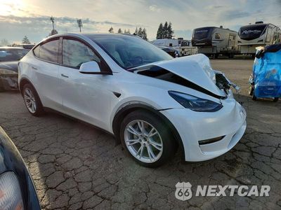 Czwarte zdjęcie samochodu z boku: 2023 TESLA MODEL Y VIN:7SAYGDEE5PF854863 - miniatura