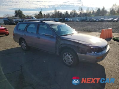 Czwarte zdjęcie samochodu z boku: 1996 TOYOTA CAMRY LE V6 VIN:4T1EF12K5TU125643 - miniatura