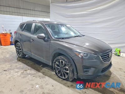 Czwarte zdjęcie samochodu z boku: 2016 MAZDA CX-5 GT VIN:JM3KE4DY5G0899120 - miniatura