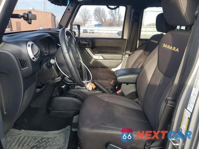 Zdjęcie 7 z 12 samochodu: 2014 JEEP WRANGLER UNLIMITED SAHARA VIN:1C4BJWEGXEL186926 - miniatura