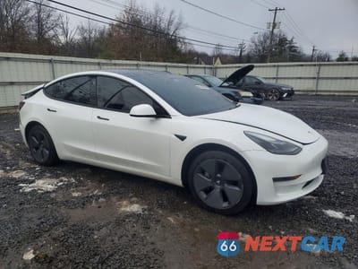 Czwarte zdjęcie samochodu z boku: 2023 TESLA MODEL 3 VIN:5YJ3E1EA8PF506810 - miniatura