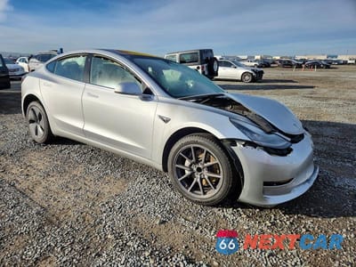 Czwarte zdjęcie samochodu z boku: 2018 TESLA MODEL 3 VIN:5YJ3E1EA1JF016538 - miniatura