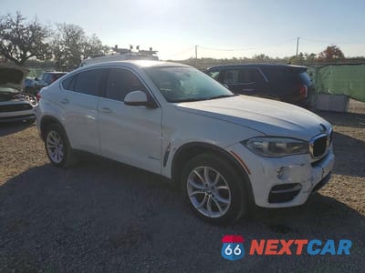 Czwarte zdjęcie samochodu z boku: 2016 BMW X6 SDRIVE35I VIN:5UXKU0C50G0F92144 - miniatura