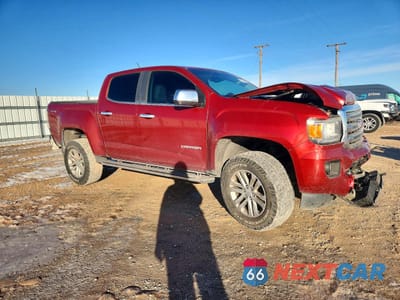 Czwarte zdjęcie samochodu z boku: 2016 GMC CANYON SLT VIN:1GTG6DE35G1389603 - miniatura