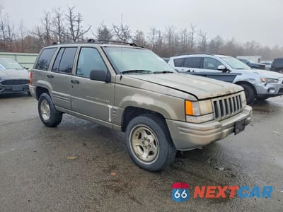 Czwarte zdjęcie samochodu z boku: 1998 JEEP GRAND CHEROKEE LAREDO VIN:1J4GZ48S9WC232244 - miniatura