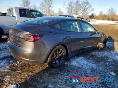 Trzecie zdjęcie samochodu z tyłu: 2023 TESLA MODEL 3 VIN:5YJ3E1EC5PF580557 - miniatura