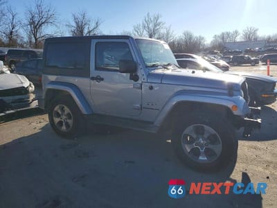 Czwarte zdjęcie samochodu z boku: 2016 JEEP WRANGLER SAHARA VIN:1C4AJWBG0GL307823 - miniatura