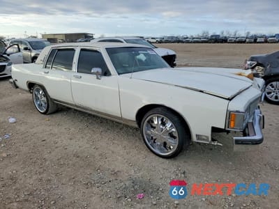 Czwarte zdjęcie samochodu z boku: 1984 OLDSMOBILE 98 REGENCY VIN:1G3AG69YXEM807086 - miniatura