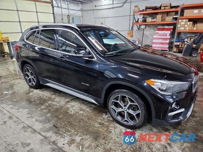 Czwarte zdjęcie samochodu z boku: 2018 BMW X1 XDRIVE28I VIN:WBXHT3C31J5F92200 - miniatura