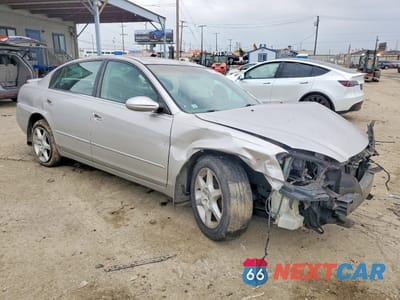 Czwarte zdjęcie samochodu z boku: 2003 NISSAN ALTIMA SE VIN:1N4BL11D03C182069 - miniatura