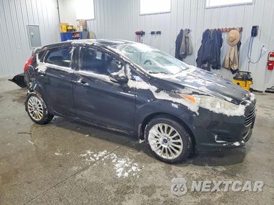 Czwarte zdjęcie samochodu z boku: 2014 FORD FIESTA VIN:3FADP4FJ4EM163085 - miniatura