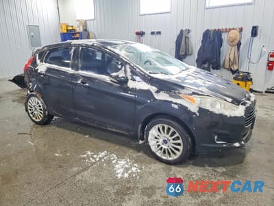 Czwarte zdjęcie samochodu z boku: 2014 FORD FIESTA TITANIUM VIN:3FADP4FJ4EM163085 - miniatura