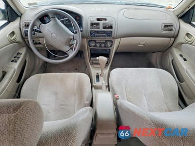 Zdjęcie 8 z 11 samochodu: 2001 TOYOTA COROLLA LE VIN:2T1BR12E01C465897 - miniatura