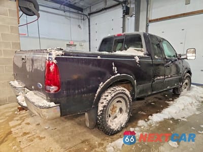 Trzecie zdjęcie samochodu z tyłu: 1999 FORD F150 VIN:1FTRX18LXXNB58401 - miniatura