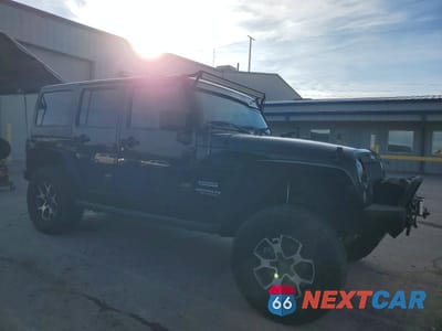 Czwarte zdjęcie samochodu z boku: 2014 JEEP WRANGLER UNLIMITED SPORT VIN:1C4BJWDG3EL325019 - miniatura