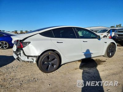 Trzecie zdjęcie samochodu z tyłu: 2023 TESLA MODEL 3 VIN:5YJ3E1EA7PF599738 - miniatura