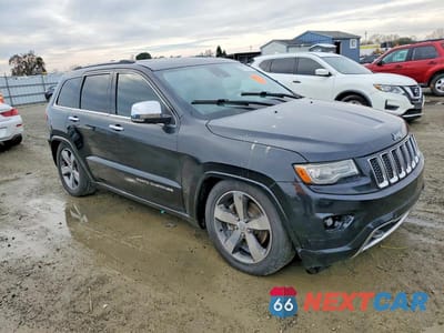 Czwarte zdjęcie samochodu z boku: 2014 JEEP GRAND CHEROKEE OVERLAND VIN:1C4RJFCM4EC521167 - miniatura
