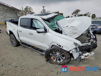 Czwarte zdjęcie samochodu z boku: 2024 GMC CANYON DENALI VIN:1GTP6FEK7R1190798 - miniatura