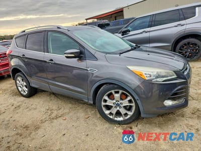 Czwarte zdjęcie samochodu z boku: 2016 FORD ESCAPE TITANIUM VIN:1FMCU9J99GUA01892 - miniatura