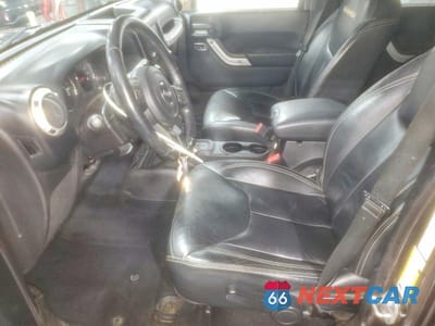 Zdjęcie 7 z 11 samochodu: 2014 JEEP WRANGLER UNLIMITED SAHARA VIN:1C4HJWEG0EL174181 - miniatura