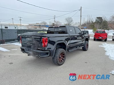 Czwarte zdjęcie samochodu z boku: 2019 GMC SIERRA K1500 AT4 VIN:1GTP9EEL8KZ167760 - miniatura