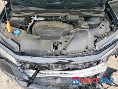 Zdjęcie 12 z 14 samochodu: 2021 HONDA PASSPORT ELITE VIN:5FNYF8H00MB012127 - miniatura