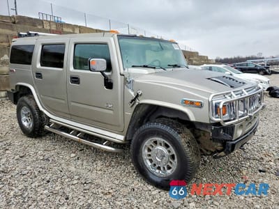 Czwarte zdjęcie samochodu z boku: 2004 HUMMER H2 VIN:5GRGN23U04H102723 - miniatura