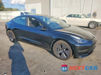 Czwarte zdjęcie samochodu z boku: 2022 TESLA MODEL 3 VIN:5YJ3E1EB1NF307801 - miniatura
