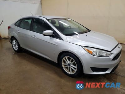 Czwarte zdjęcie samochodu z boku: 2016 FORD FOCUS SE VIN:1FADP3F21GL267377 - miniatura