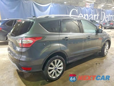 Trzecie zdjęcie samochodu z tyłu: 2017 FORD ESCAPE TITANIUM VIN:1FMCU0J97HUA21586 - miniatura