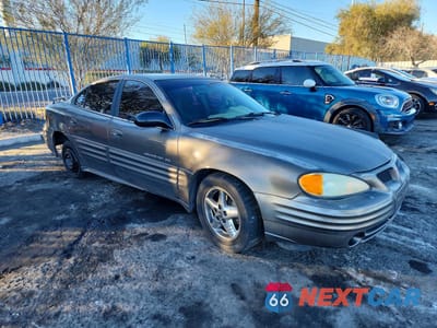 Czwarte zdjęcie samochodu z boku: 2002 PONTIAC GRAND AM SE1 VIN:1G2NF52F62C198706 - miniatura