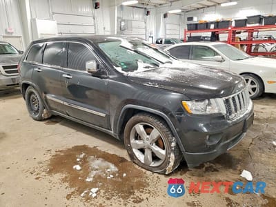 Czwarte zdjęcie samochodu z boku: 2012 JEEP GRAND CHEROKEE OVERLAND VIN:1C4RJFCT8CC166685 - miniatura