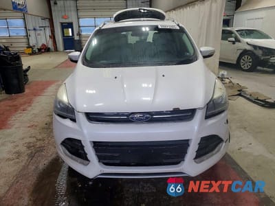 Piąte zdjęcie samochodu w środku: 2016 FORD ESCAPE TITANIUM VIN:1FMCU9JX8GUA58471 - miniatura