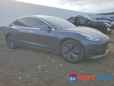 Czwarte zdjęcie samochodu z boku: 2018 TESLA MODEL 3 VIN:5YJ3E1EA8JF058690 - miniatura
