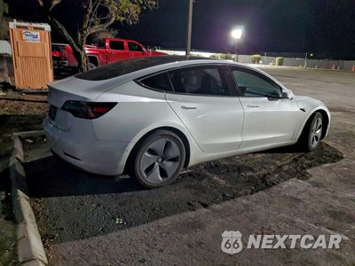 Trzecie zdjęcie samochodu z tyłu: 2018 TESLA MODEL 3 VIN:5YJ3E1EA4JF039005 - miniatura