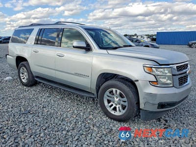 Czwarte zdjęcie samochodu z boku: 2019 CHEVROLET SUBURBAN C1500 LT VIN:1GNSCHKC6KR201509 - miniatura