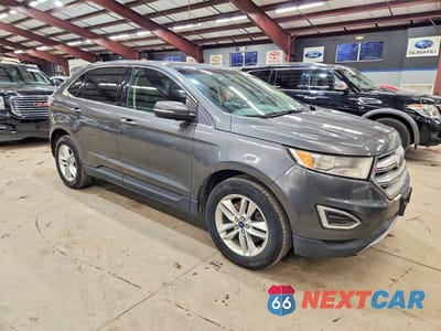Czwarte zdjęcie samochodu z boku: 2015 FORD EDGE SEL VIN:2FMTK4J92FBC36292 - miniatura