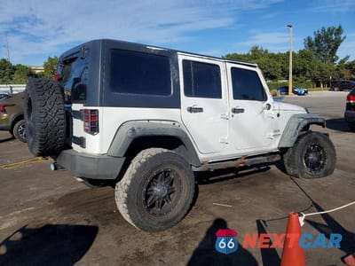 Trzecie zdjęcie samochodu z tyłu: 2014 JEEP WRANGLER UNLIMITED SPORT VIN:1C4BJWDG7EL156610 - miniatura