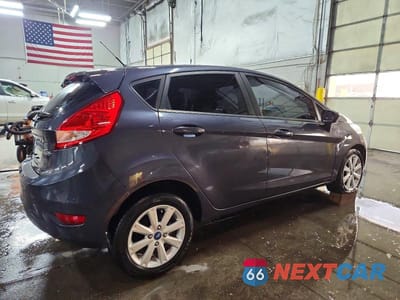 Trzecie zdjęcie samochodu z tyłu: 2012 FORD FIESTA SE VIN:3FADP4EJ0CM111872 - miniatura