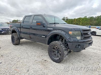 Czwarte zdjęcie samochodu z boku: 2014 FORD F150 SUPERCREW VIN:1FTFW1ET3EFC70555 - miniatura