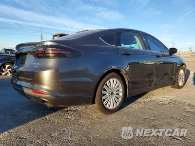 Trzecie zdjęcie samochodu z tyłu: 2016 FORD FUSION SE HYBRID VIN:3FA6P0LU5GR406294 - miniatura