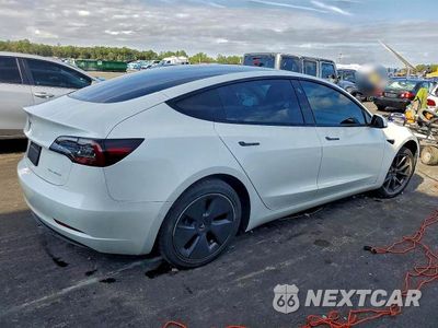 Trzecie zdjęcie samochodu z tyłu: 2021 TESLA MODEL 3 VIN:5YJ3E1EBXMF010086 - miniatura