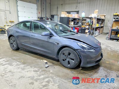 Czwarte zdjęcie samochodu z boku: 2023 TESLA MODEL 3 VIN:5YJ3E1EA4PF428798 - miniatura