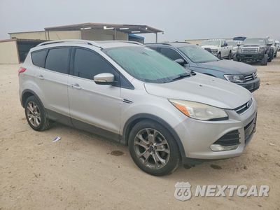 Czwarte zdjęcie samochodu z boku: 2014 FORD ESCAPE TITANIUM VIN:1FMCU0JX2EUC44645 - miniatura