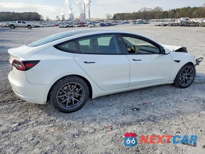Trzecie zdjęcie samochodu z tyłu: 2023 TESLA MODEL 3 VIN:5YJ3E1EB0PF388096 - miniatura