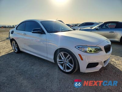 Czwarte zdjęcie samochodu z boku: 2015 BMW 228 I SULEV VIN:WBA1F9C53FVW98465 - miniatura