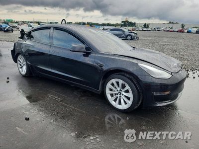 Czwarte zdjęcie samochodu z boku: 2022 TESLA MODEL 3 VIN:5YJ3E1EB2NF169993 - miniatura